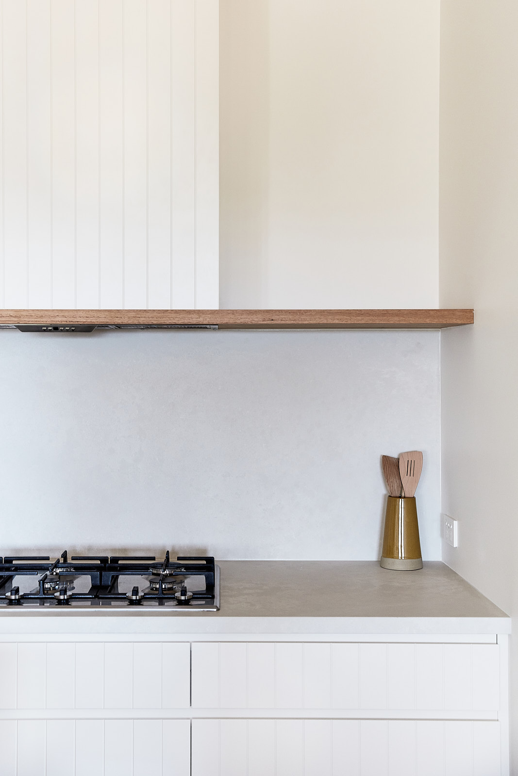 Kitchen stove top on stone benchtop in speckled white