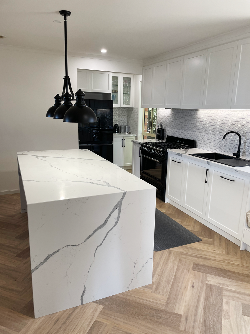 White stone marble benchtop installed in a white kitchen in geelong